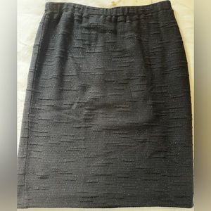 Black shimmer St John knit skirt size 14.  NWT. Has silver specs. See fabric